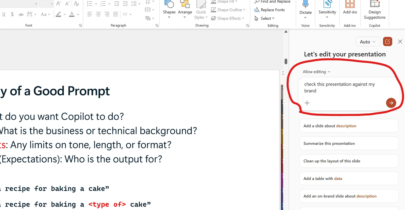 PowerPoint with the Copilot side panel open on the right. A red circle highlights the prompt input box containing the typed phrase 'check this presentation against my brand'. Below the input are suggestion chips like 'Summarize this presentation', 'Clean up the layout of this slide', and 'Add an on-brand slide about description'. The slide visible on the left shows a 'Good Prompt' anatomy with bullet points.