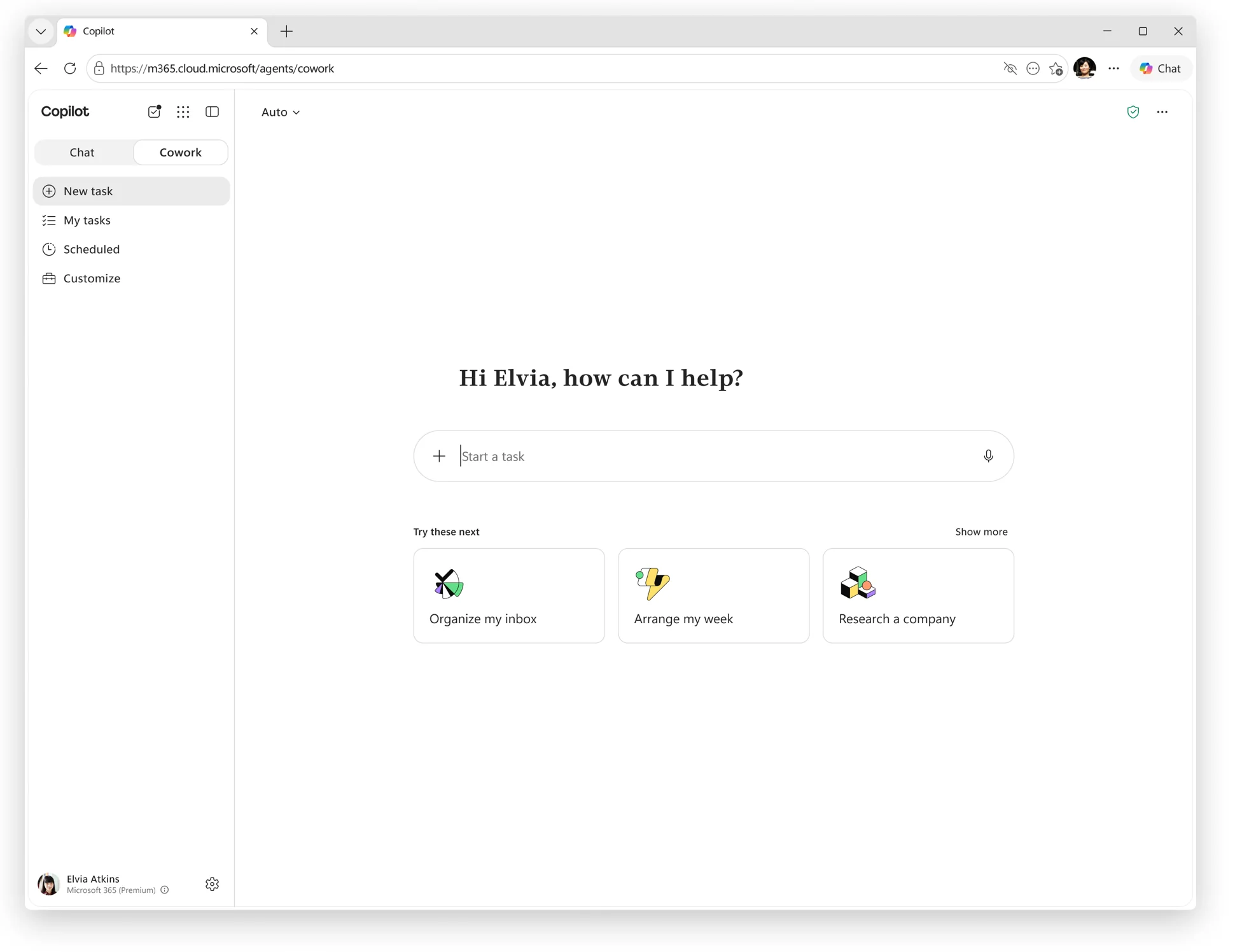 The Copilot Cowork home screen in the browser at m365.cloud.microsoft, with a Chat / Cowork toggle, a left sidebar (New task, My tasks, Scheduled, Customize), a 'Start a task' box and suggested tasks such as 'Organize my inbox', 'Arrange my week' and 'Research a company'.
