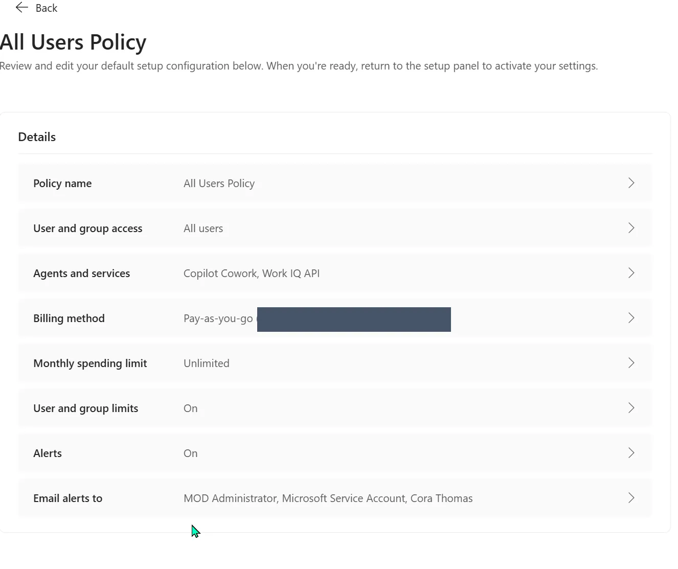 All Users Policy review summary showing User and group access set to All users, Agents and services set to Copilot Cowork and Work IQ API, Billing method Pay-as-you-go with the subscription redacted, Monthly spending limit Unlimited, and Alerts on.