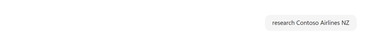 A Cowork chat bubble in the top-right of the conversation showing the typed user input 'research Contoso Airlines NZ'. No other text or response is visible yet — the rest of the conversation area is empty.